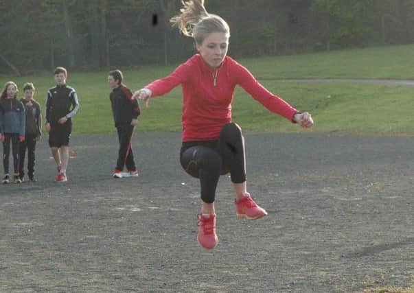Young athlete Emily jumps into action at the first night of training at the Larne AC Junior Academy. INLT 19-916-CON