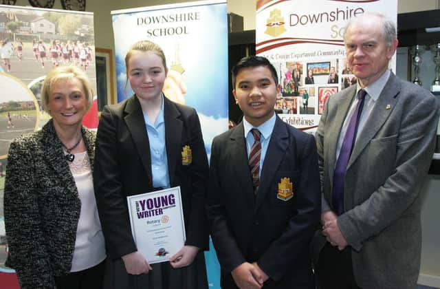 Downshire pupils Tori Atkinson and Robert Gonzales are congratulated on their writing success by Mr Dunlop and Mrs Houston, president, Carrickfergus Rotary Club. INCT 19-735-CON