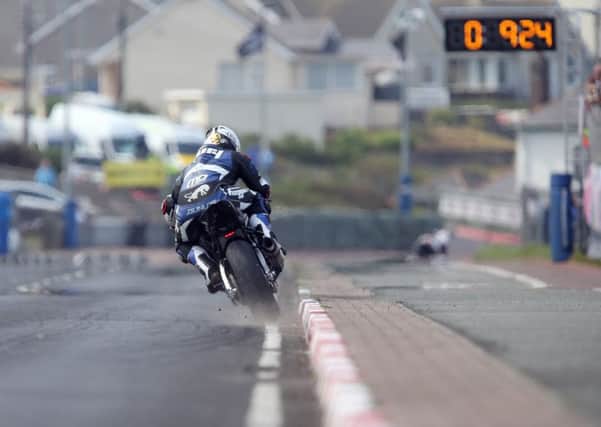 Michael Dunlop kicks up the dust on his way to setting the fastest time on his Hawk BMW Superbike at the Vauxhall International North West 200 on Tuesday.