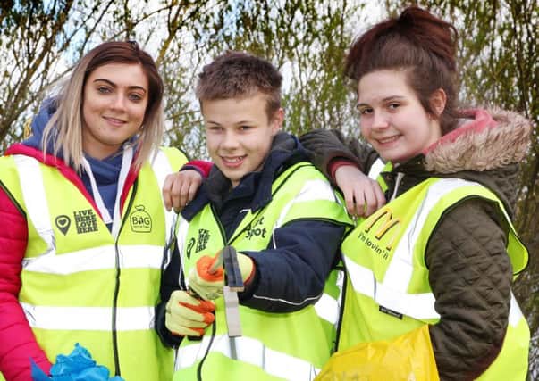 Hannah McNeill and Amy Purdy, staff members of McDonald's Coleraine, pictured with Sandelford School Coleraine pupil Jack McCorriston during the BIG Spring Clean at the River Bann Walk Path in Coleraine.