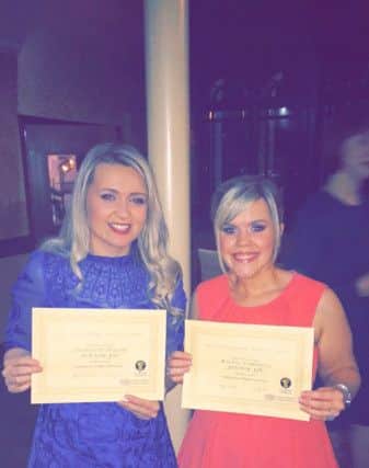 Club members Charlotte Taylor and Rachel Campbell were presented with a merit each for their acting skills. INBM21-16S