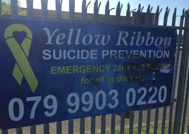 Vandals have damaged a suicide prevention sign.