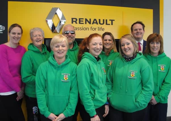 Members of County Antrim Harriers pictured at Charles Hurst Renault, the main sponsor of the club's May Fair 10k.  INLT 19-918-CON