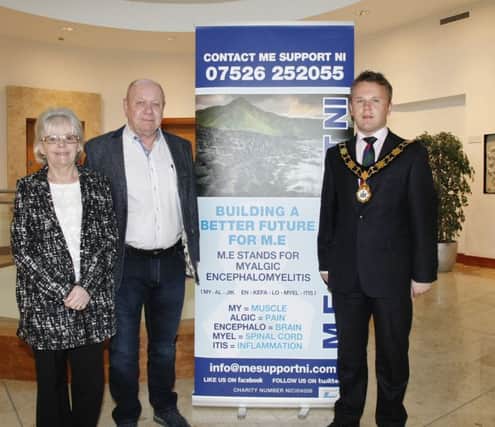 Mayor of Antrim and Newtownabbey, Councillor Thomas Hogg is joined by ME sufferers, Mags and David Maloney.