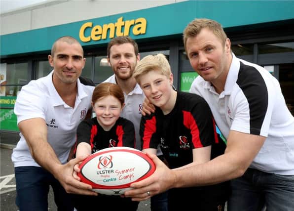 Ulster Rugby stars Darren Cave, Roger Wilson and Ruan Pienaar help young players Nathan and Abi Toland from Carrickfergus kick-off the 2016 Centra Ulster Rugby Summer Camps.