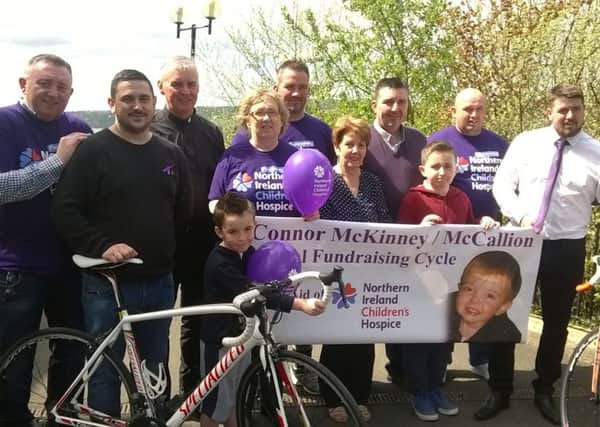 Supporting the Londonderry to Greencastle Cycle are, back row, from left: Junior Morrison, Fr Michael Canny, Stephen Mccallion, Paul mccallion, Conor Mcfadden, and front, Liam Shiels, Mary O'Neill Chairperson Childrens Hospice, Caiden McKinney, Maureen McKinney, Patrick Mccallion and Stephen Brolly.