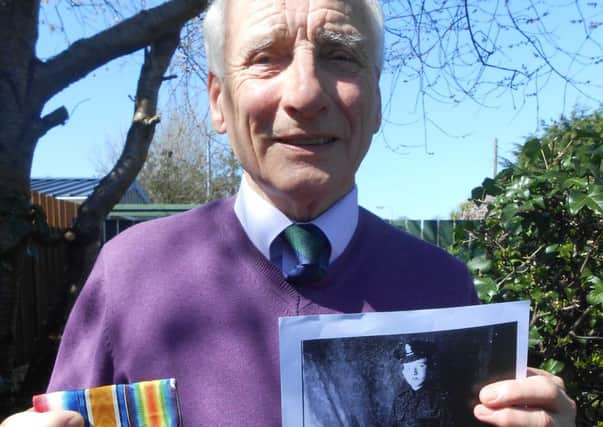 Larne man David McNeill proudly shows his fathers medals and photo.  INLT 20-652-CON