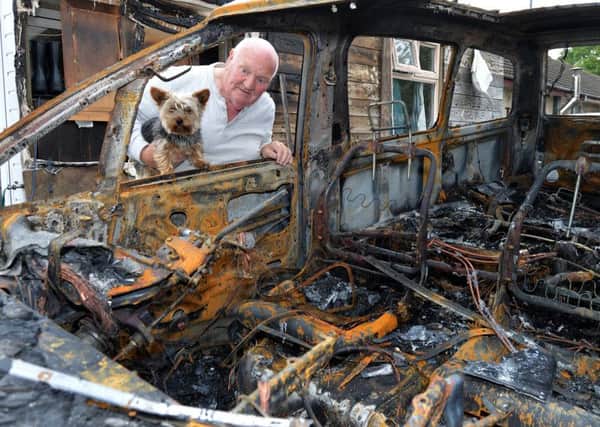 Rosmoyle resident, Michael Kingham pictured with his burned out car following an arson attack at the weekend. INLM20-209.