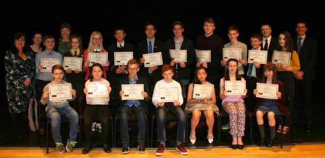Pictured at the Education Authority's  Music Service Prizenight, EA Music Service Officers Janet Cooke, Naoimh Simpson, Anne Bergin, John Bergin and Simon O'Hare with young musicians who received their graded certificates at the Strule Arts Centre Omagh. Back Row (l-r): Robert Henderson Lumen Christi College (Grade 6); Orlaith McCaffrey Loreto GS (Grade 3); Elle Gilmore Collegiate GS (Grade 3); Jacky Cheung Portora Royal GS (Grade 1); Patrick McCrystal Christian Brother GS (Grade 8); Samuel Coalter Portora Royal (Grade 5); Stephen Humphreys Portora Royal GS (Grade 7); Aidan Kelly Christian Brothers GS (Grade 7); DJ (Daniel) Dunn St Joesph's Boys HS (Grades 5 & 7) and Maria Gallagher Lumen Christi College (Grade 5).