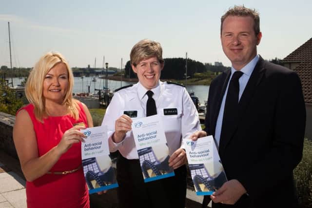 Pictured with the PCSP leaflet offering advice for those affected by anti-social behaviour are Housing Services Manager, Pamela Mullan, PSNI Chief Inspector, Catherine Magee and PCSP Chair, Councillor James McCorkell. INBM21-16S