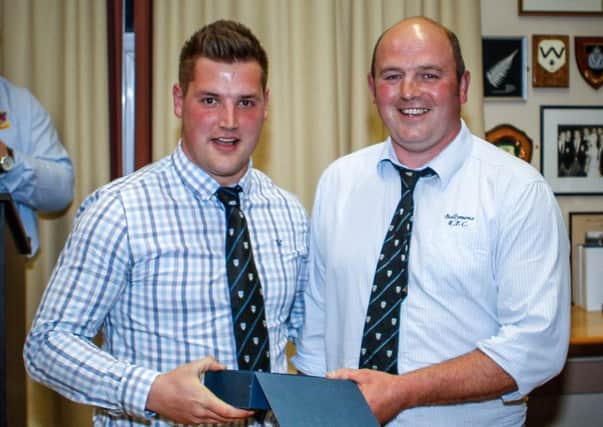 Rodger McBurney receives the Player of the Year award from head coach Andy Graham. Pictures courtesy of Ardclinis Photography.