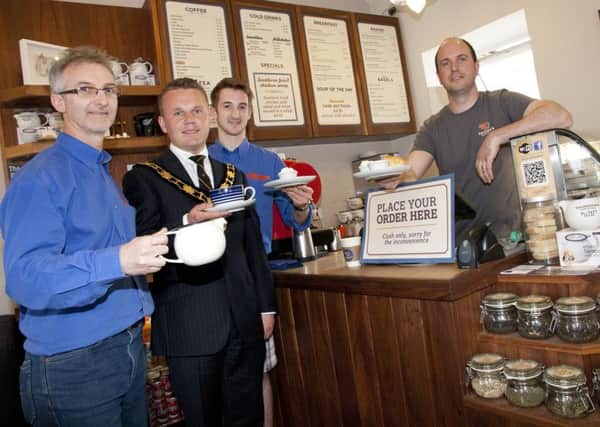 Cllr Thomas Hogg, samples some treats that will be on offer during this years May Fair with Mark Davis and Andrew Davis (Pots of Pleasure) and Daniel McKee (Browns Coffee Company). INNT 20-812CON