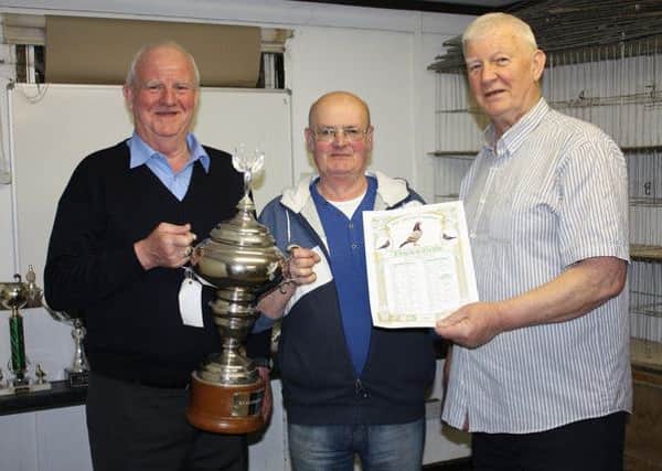 Paddy McManus with Ahoghill officials Tom Young and Albert Young. The McManus team won 1st Open NIPA from Roscrea.