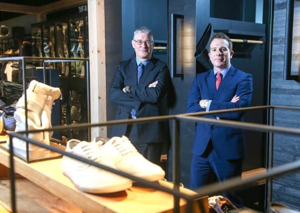 Pictured in the new Jack & Jones store are Jonathan Martin (right), an Associate Director at Lambert Smith Hampton and Mark Stewart (left), Centre Manager for The Abbeycentre. INNT 20-816CON