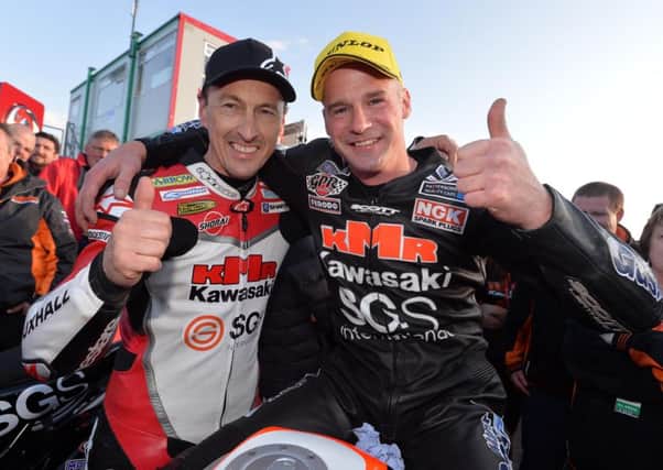 Ryan Farquhar (right), pictured with his SGS KMR Kawasaki team-mate Jeremy McWilliams at last year's North West 200, is now in a stable condition in hospital.