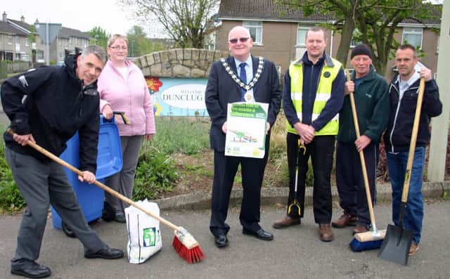 Mid and East Antrim Mayor, Councillor Billy Ashe joins Councils Environmental Health Officer, Kevin Woodin, left, Ciaran Bradley, Borough Enforcement Officer, third from right and Patricia McQuillan of the Dunclug Partnership with local resident Harry McKeown, and Richard Hastings from Green Pasture (extreme right) in a spring clean-up in Ballymena. (Submitted Picture).