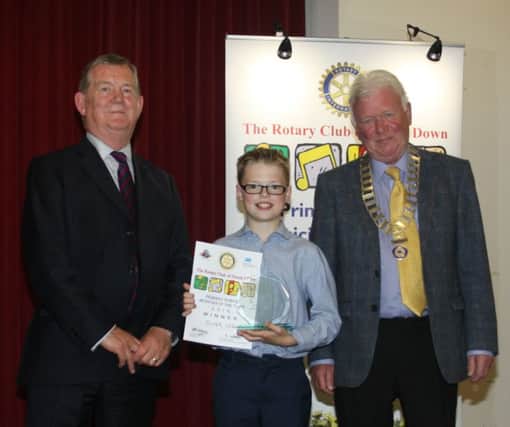 Oliver Logan of Groggan Primary School, Randalstown is 2016's Primary Musician of the Year. He is seen with Dr Joe McKee, Finals Adjudicator and President Campbell Whyte of the Rotary Club of North Down who organise the competition.