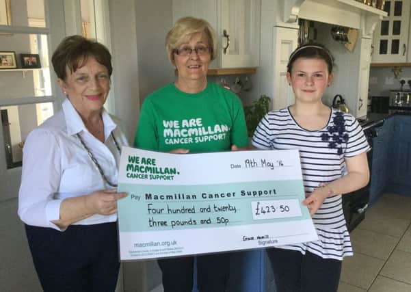 Grace Hamill and her grandmother Margaret Mcosker  presented Iris McKeown from Macmillan Cancer Support with a cheque for Â£423.50 the proceeds from Grace's sponsored silence. She did this in memory of her late grandfather Vincent Mcosker. Grace would like to thank all the family and friends who supported her especially the teachers and pupils of St Pius's who encouraged her throughout her day of silence.