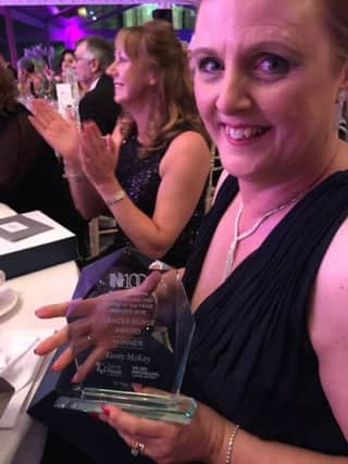 Cancer Nurse of the Year Kirsty McKay proudly shows off her award. INLT-20-706-con