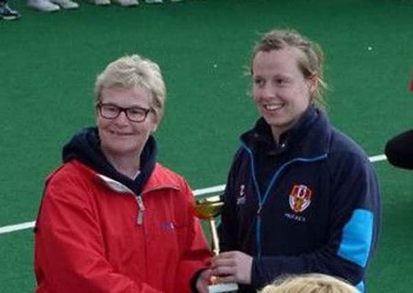 Ulster Elks skipper Megan Frazer is presented with the EuroHockey Club Champions Challenge I trophy in Prague. INLT 20-925-CON