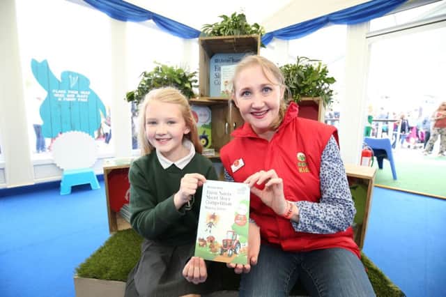 At the showgrounds in Balmoral Park were Clidhna McTague, P6 St Patrick's PS Rashakin,  one of the winners of the Ulster Bank Farm Safty Competition pictured with Agri Kids funder Alma Jordan. The book of Short Stories will be available for download free of charge to all schools in Northern Ireland.
Picture by Andrew Paton/Press Eye.com