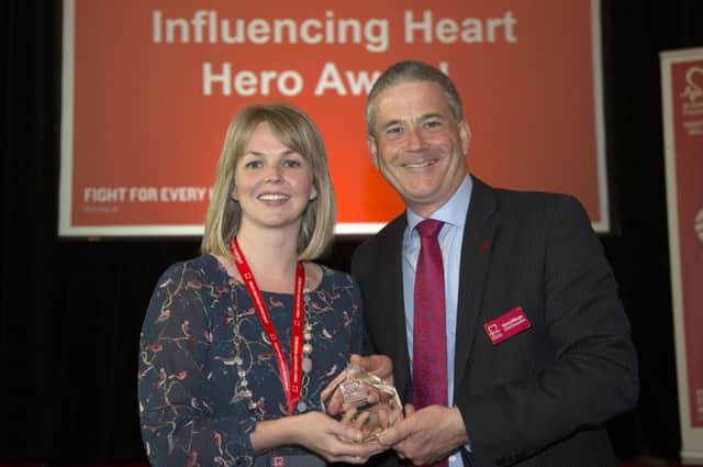 Karen Rennie pictured receiving her award from Simon Gillespie, Chief Executive of British Heart Foundation.  Picture: Kevin Cooper/Photoline