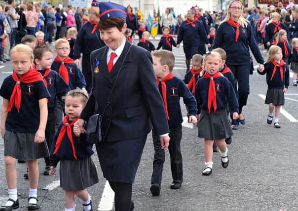 Brenda Johnston with St Columba's Penguins during Sunday's Commonwealth Day Youth Parade last year. INPT24-232.