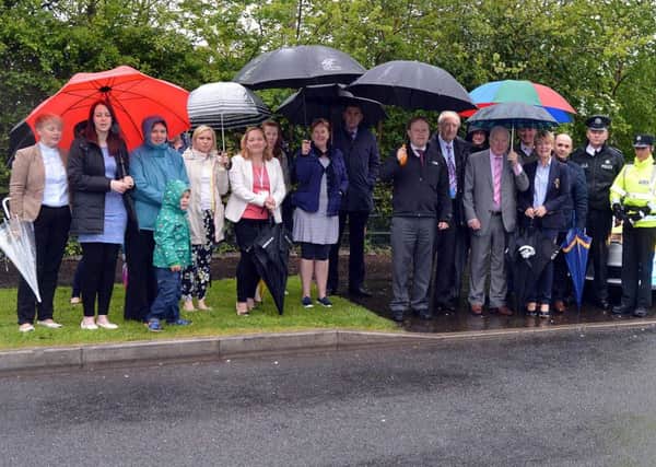 Teachers, parents, local councillors and police hold a meeting outside Derryhale Primary School to discuss traffic issues. INPT21-200.