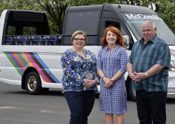 Pictured are Daniele Delahunt, Business Manager at Danske Bank (centre) with Rodney and Caroline McComb, Directors at McComb's Coach Travel. INNT 21-804CON