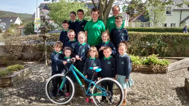 Pupils from St Ciaran's Primary with bike prize for winning the Big Pedal in the Causeway & Glens area. inbm22-16s