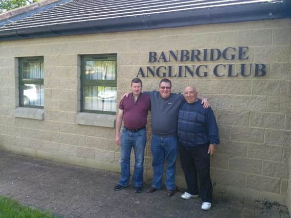 Banbridge Angling Club's Shooter Cup winner Martin Dynes (center) is flanked by second placed Paddy Burns (left) and third placed Jim Warren (right).