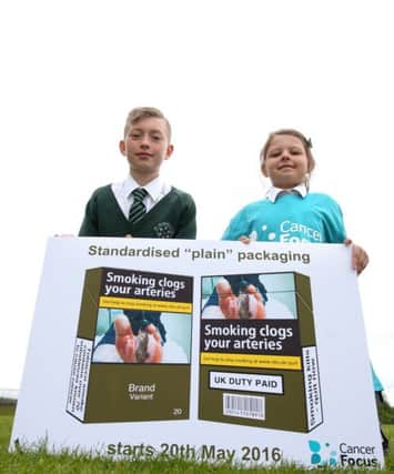 Pupils are delighted with new legislation that came into force on Friday that stops the tobacco industry from selling cigarettes in bright, glitzy packs to attract children. inbm22-16s