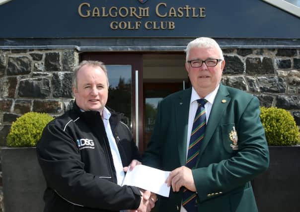 Sean McCreedy of Doyle Shipping Group presents sponsorship for the Stableford competition at Galgorm Castle Golf Club to club captain Ian Henry. INBT 20-170CS