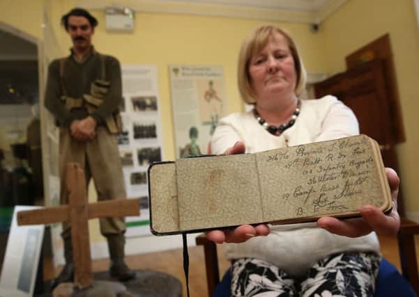 Helen McComb from Glenanne holds the diary of her great uncle Private Thomas Chambers, known as Tommy. Photo Brian Lawless/PA Wire