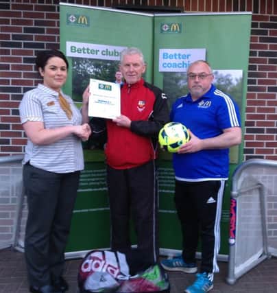Banbridge Town Juniors Chairman Peter Watson receives the Certificate Award at a McDonald's IFA presentation in Craigavon. Included are McDonald's Representative and Keith Hall Mid Ulster/IFA GD Co-ordinator