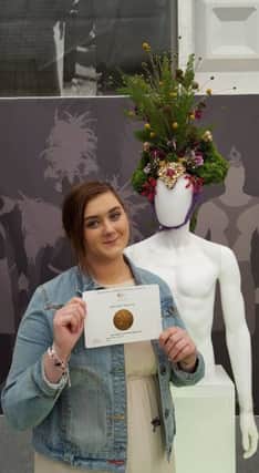 Shannon Ormandy from Ballymena proudly displays the bronze medal she won at the Chelsea Flower Show. (Submitted Picture)