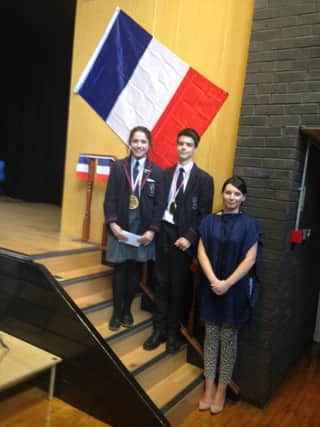Wallace High School pupils Holly Mackin and Luke Holden who were the finalists in the recent Spelling Bee competition run by the Languages Department. Also pictured is teacher and host, Mrs Maria Allen.