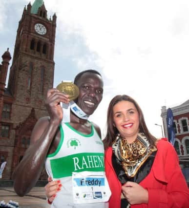 DEFENDING CHAMPION . . . Freddy Sittuk from Kenya, winner of the 2015 Walled City Marathon receives his medal from mayor Elisha McCallion in Guildhall Square.
