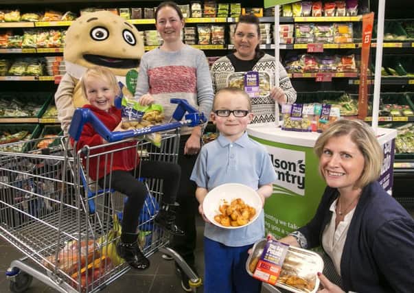 Emma Davison and her children Jennifer (3) and Christopher (5) from Scarva, with Siobhan McKay, Store Manager of Tesco NI Metro, Banbridge and Joanne Weir, Sales and Marketing Manager for Wilsons Country.