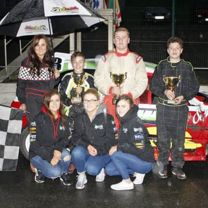 Drew McKeown (second right) showing off his prize at Tullyroan Oval with rival drivers plus representatives of the venue and sponsors. Pic by Brian Lammey.