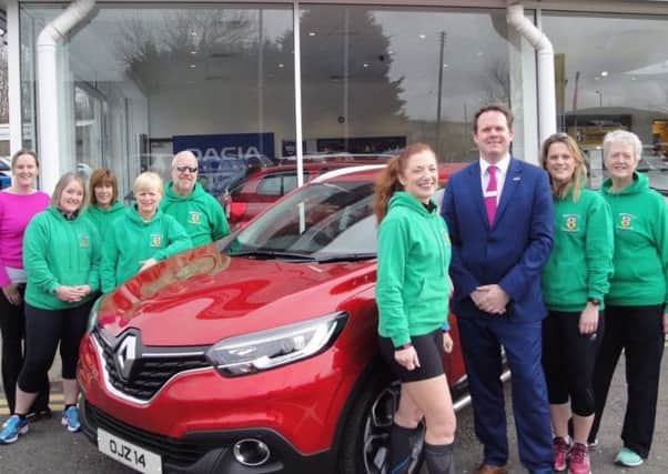 Members of County Antrim Harriers with the Sales Manager John Platt, of main May Fair race sponsor Charles Hurst Renault. INLT 21-921-CON
