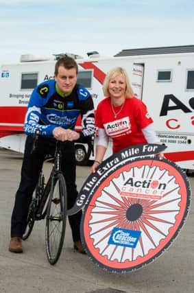 Action Cancer is calling on all cycling enthusiasts in Antrim to go the extra mile for those affected by cancer and help raise vital funds by cycling the distance that the Big Bus will travel in 2016.  Pictured are Arlene Creighton, Events Office with Action Cancer and Neil McGuigan, Retail Manager with Chain Reaction Cycles. To register visit www.actioncancer.org, contact Action Cancer on 028 9080 3379, or email cycle@actioncancer.org.