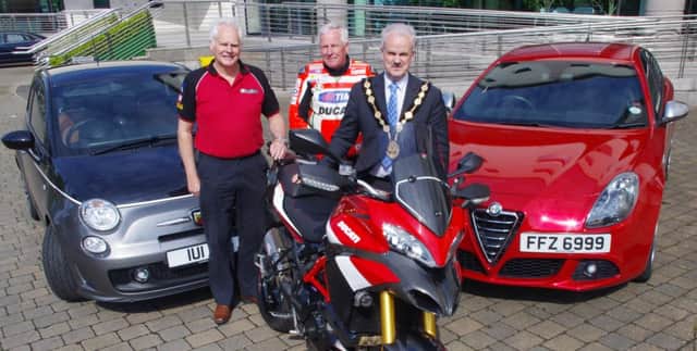 Mayor of Lisburn and Castlereagh, Thomas Beckett pictured with brothers Cyril and David McMullen ahead of the Northern Ireland Italian Motor Clubs All Ireland Italian Motor Event at Lagan Valley Island on Saturday 28th May.