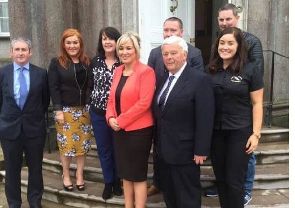 Assembly Health Minister, Michelle O'Neill, poses for photos with committee members from the Niamh Louise Foundation, including founder members James and Catherine McBennett.