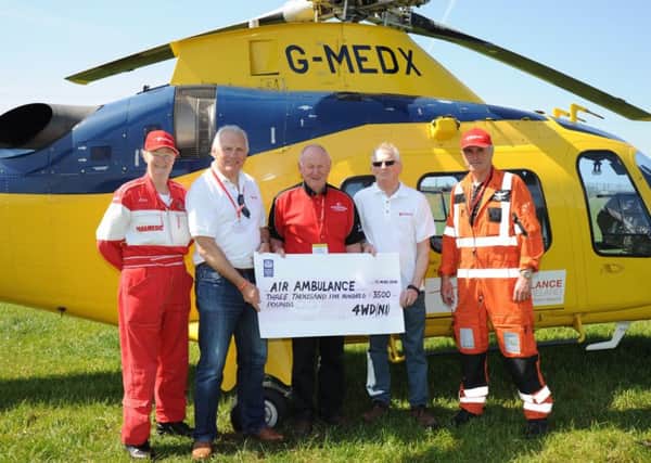 Paramedic Jane Cragg, Air Ambulance Charity Chairman Ian Crowe, NW200 Race Director Mervyn Whyte, Sperrin Charity Trial organiser Kenny Thompson, Pilot John Murray.