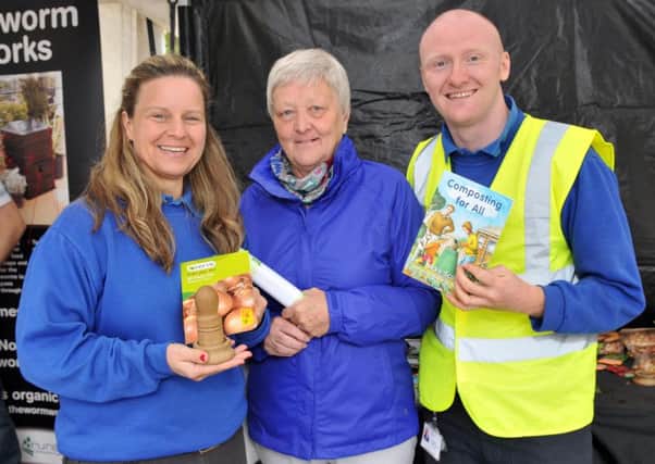 Kirsty Pinkerton, Lurgan Market Manager and David Phillips, Recycling Inspector give Mrs Liz Adair details on recycling and composting.