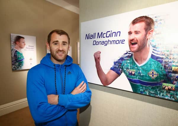 Ex-Derry City winger Niall McGinn pictured with the giant billboards featuring the Northern Ireland squad and manager Michael O'Neill which are up across the country as the excitement around EURO 2016 begins in earnest. Picture by William Cherry
