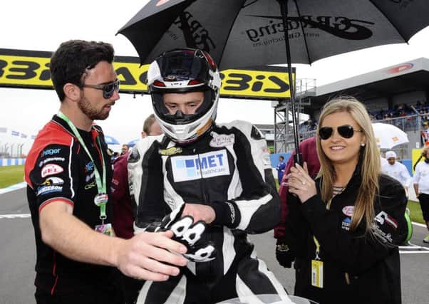 Andrew Irwin with his girlfriend, Jemma, and brother, Glenn, before his World Supersport race. INLT 22-914-CON
