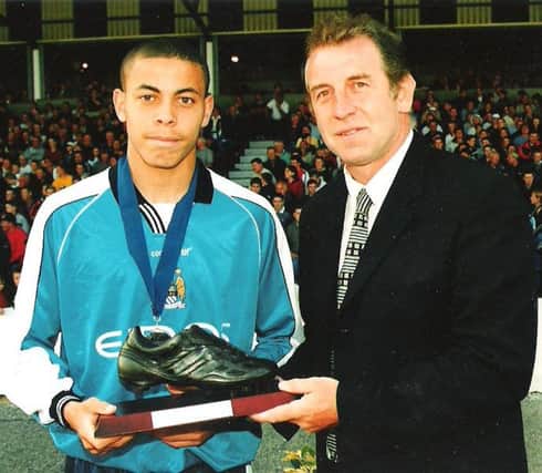 Gerry Armstrong presents an award to Manchester City's Doryll Profitt in the 2000 tournament