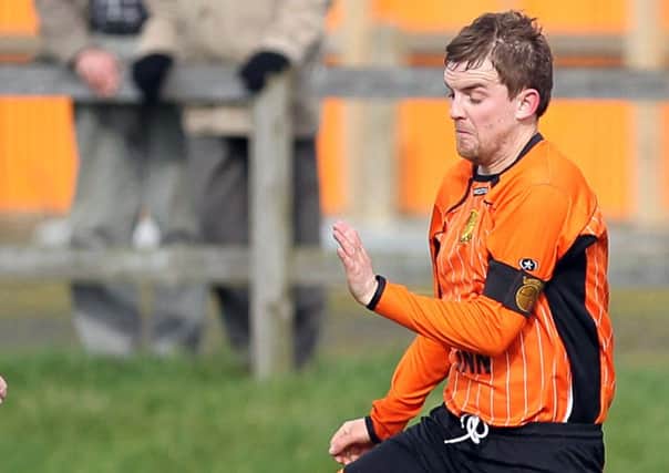 Paul Mathers in action for Barn United.